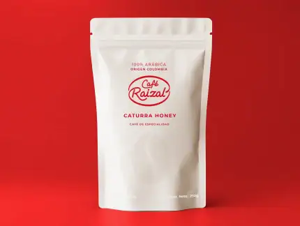 Café Raizal, café natural de origen colombiano, en paquete de 250g con sabor a catura honey, ideal para los amantes del café de especialidad.